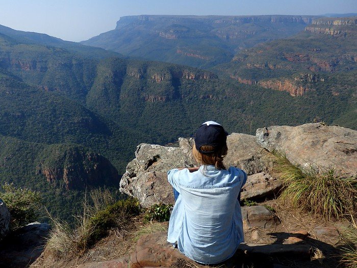 Looking out over the Blyde River Canyon in South Africa is a contemplative That Backpacker Audrey Bergner taking in the epic scenery 
