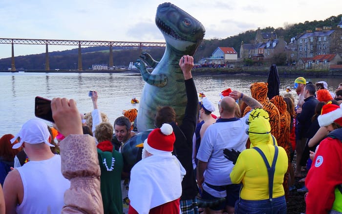 Loony Dookers and an inflatable dinosaur ready to go into the Firth of Forth on a chilly day in Scotland 