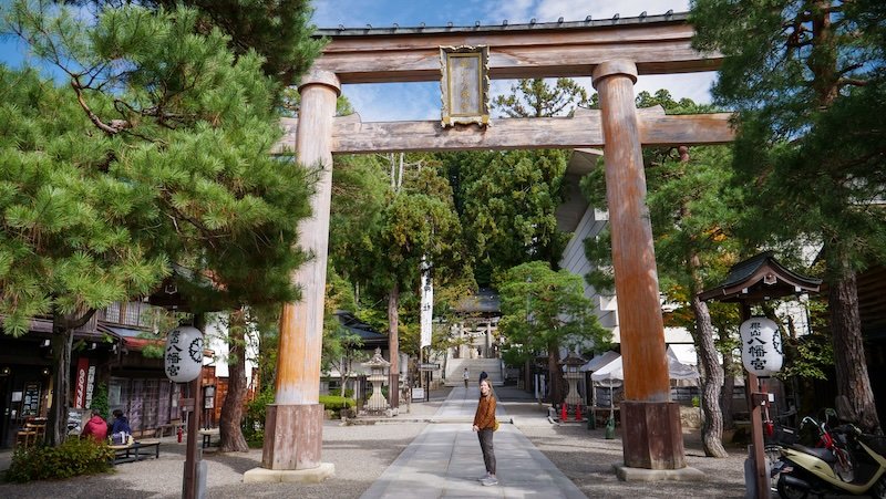 Massive Tori Gate in Takayama, Japan that is wooden and rustic and makes That Backpacker Audrey Bergner look tiny in comparison 