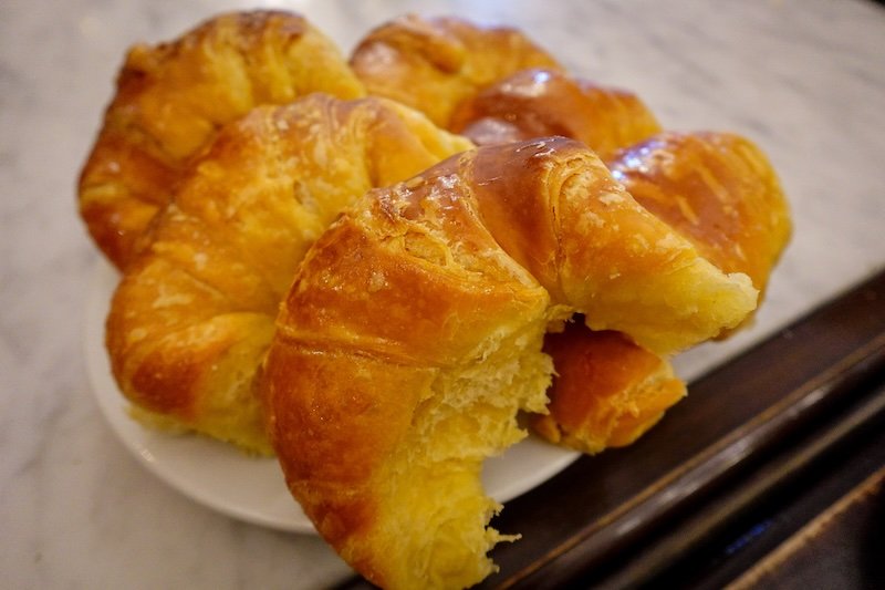Medialunas served on a plate best accompanied by a cafe con leche in Buenos Aires, Argentina 