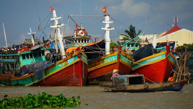 Mekong Delta colorful red fishing boats docked in Vietnam Mekong Delta colorful red fishing boats docked in Vietnam