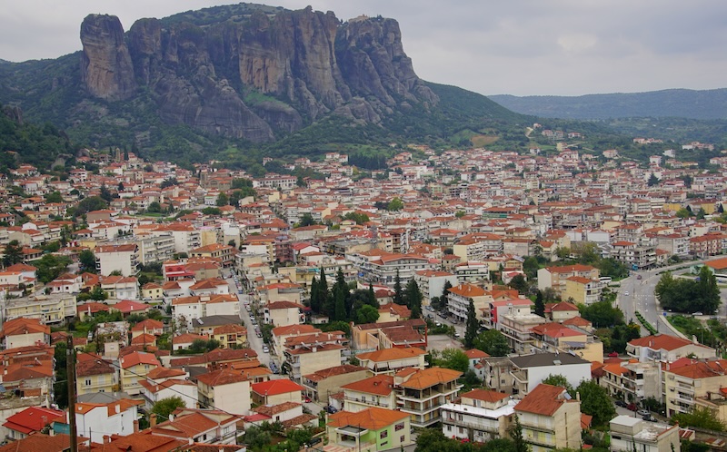 Meteora imposing landscapes and town spilling down in all directions with rooftops that are orange in Greece Meteora imposing landscapes and town spilling down in all directions with rooftops that are orange in Greece