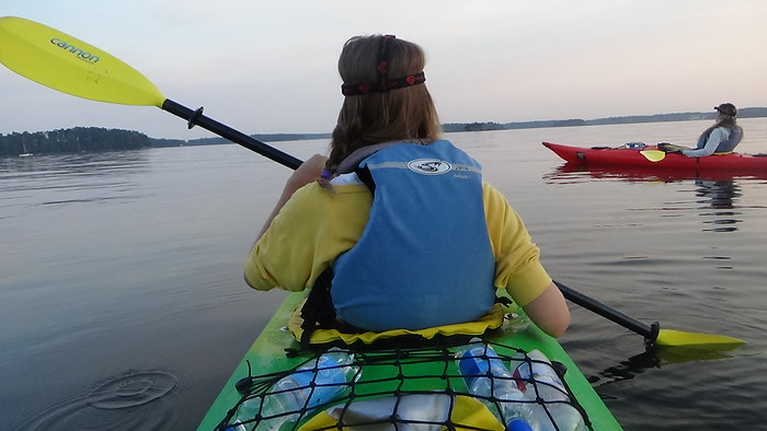 Midnight kayaking in Helsinki, Finland with That Backpacker Audrey Bergner leading the charge with her paddle in tow Midnight kayaking in Helsinki, Finland with That Backpacker Audrey Bergner leading the charge with her paddle in tow