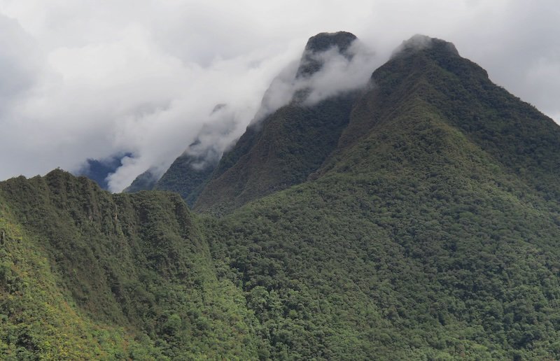 Moody mountains surrounded by clouds on the Inca Trails in Peru 