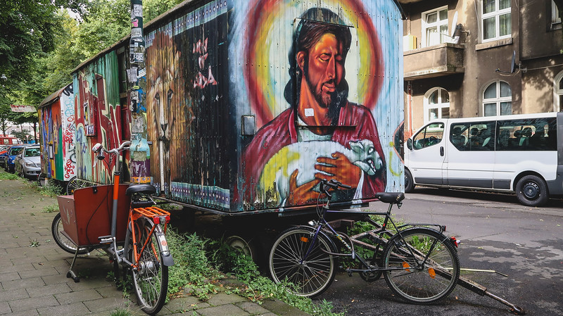 More street art in Kiefernstrasse, Düsseldorf with bicycles parked nearby in Germany 