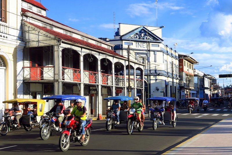 Motorcycles and autorickshaws traffic in Iquitos, Peru 