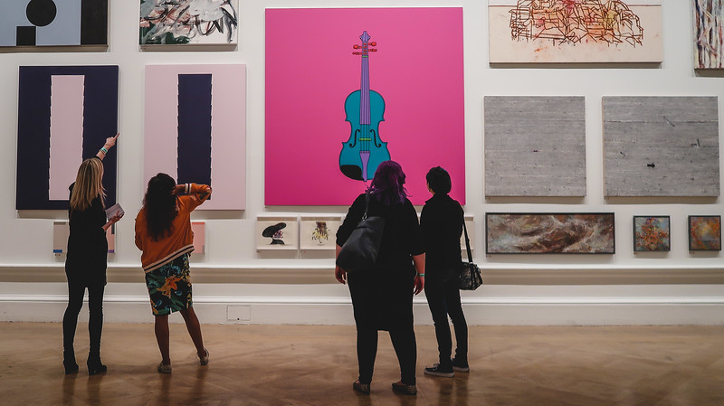 Museum lates at the Royal Academy of Arts with viewers admiring the unique displays on offer in London, England 