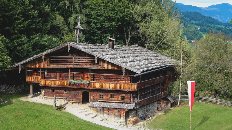 Museum of Tyrolean Farmhouses main building with multi-levels made entirely out of wood in Tirol, Austria 