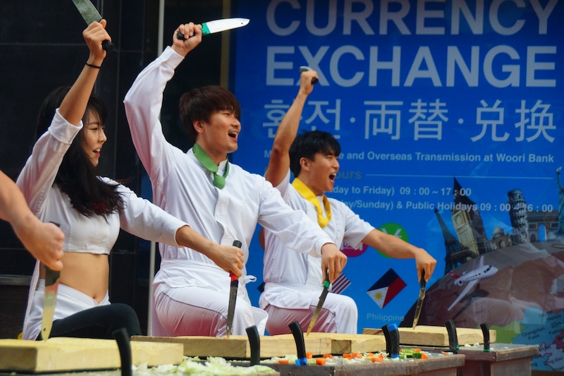 Myeongdong Nanta Korean performers with knives entertaining crowds on the street in Seoul, Korea 