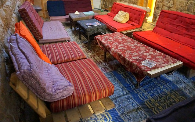 Nazareth Fauzi Azar Inn comfortable colorful couches for guests to enjoy in Israel to lounge like a lizard by day or night