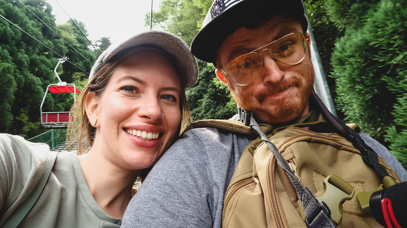 Nomadic Samuel and Audrey Bergner excited to be visiting Mount Takao, Japan on a day trip whilst taking the chair lift up the mountain