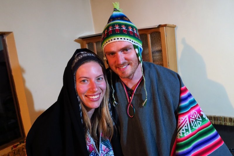 Nomadic Samuel and Audrey Bergner That Backpacker wearing traditional Peruvian attire whilst visiting Lake Titicaca, Peru 