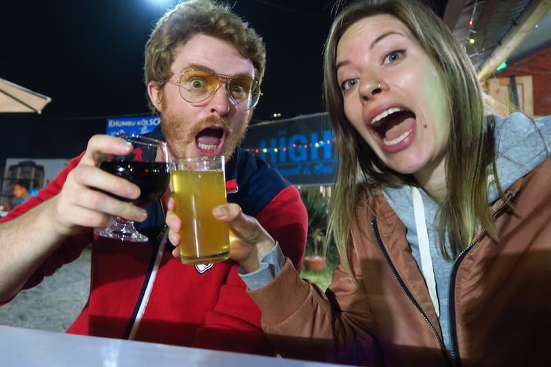 Nomadic Samuel and That Backpacker Audrey Bergner enjoying a drink at night in Pokhara, Nepal 
