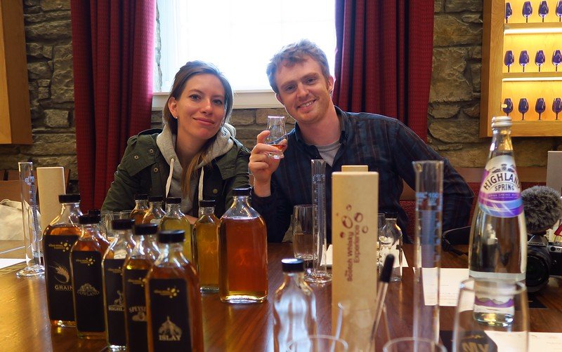 Nomadic Samuel and Audrey Bergner That Backpacker at the Scotch Whisky Experience in Edinburgh, Scotland participating in a whisky blending session with regional samples