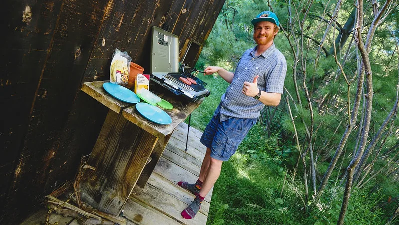 Nomadic Samuel BBQing outdoors on a small grill at our tiny shipping container home for the night in Toronto Nomadic Samuel BBQing outdoors on a small grill at our tiny shipping container home for the night in Toronto