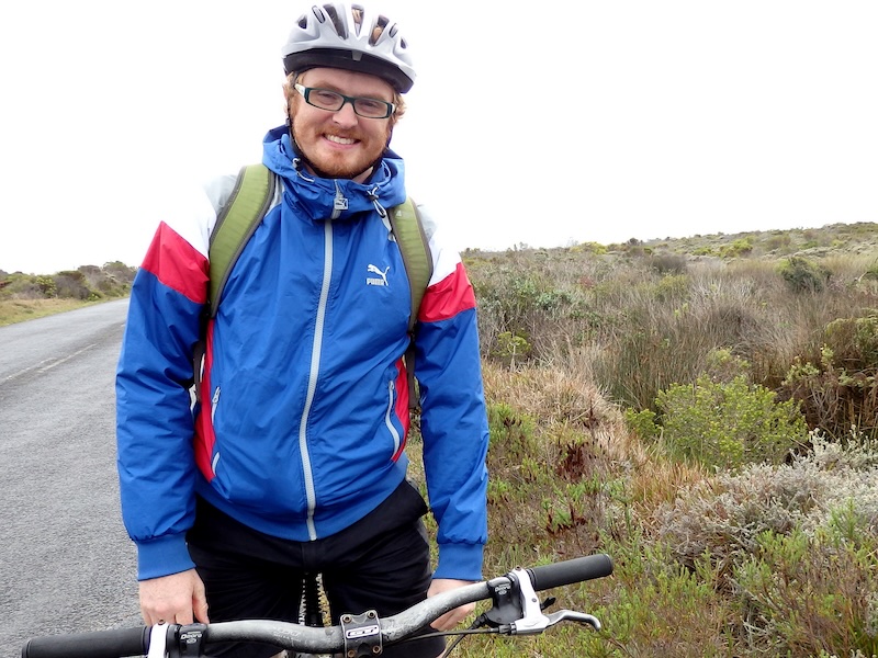 Nomadic Samuel braving the weather with a jacket and a smile during the Cape of Good Hope biking tour in South Africa Nomadic Samuel braving the weather with a jacket and a smile during the Cape of Good Hope biking tour in South Africa