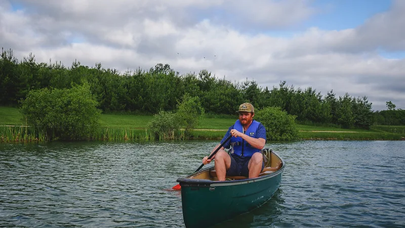 Nomadic Samuel canoeing at Jecara Farms during our off-grid cabin stay experience Nomadic Samuel canoeing at Jecara Farms during our off-grid cabin stay experience