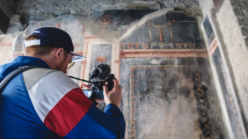 Nomadic Samuel capturing the ancient details at Herculaneum on a trip in Italy 