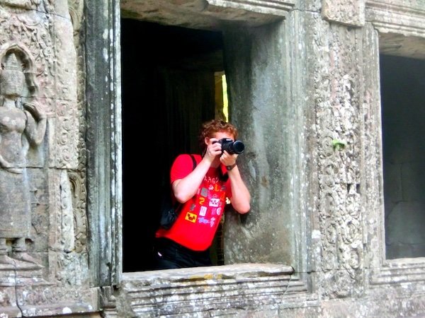 Nomadic Samuel capturing the moment with travel photography visiting the temples of Angkor, Cambodia 