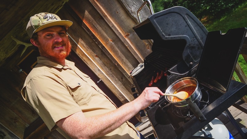 Nomadic Samuel cooking chilli for dinner off-grid in Ontario 