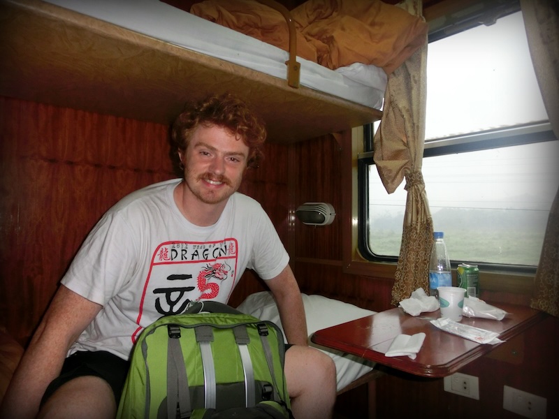 Nomadic Samuel enjoying an overnight train ride on the way to Sapa, Vietnam 