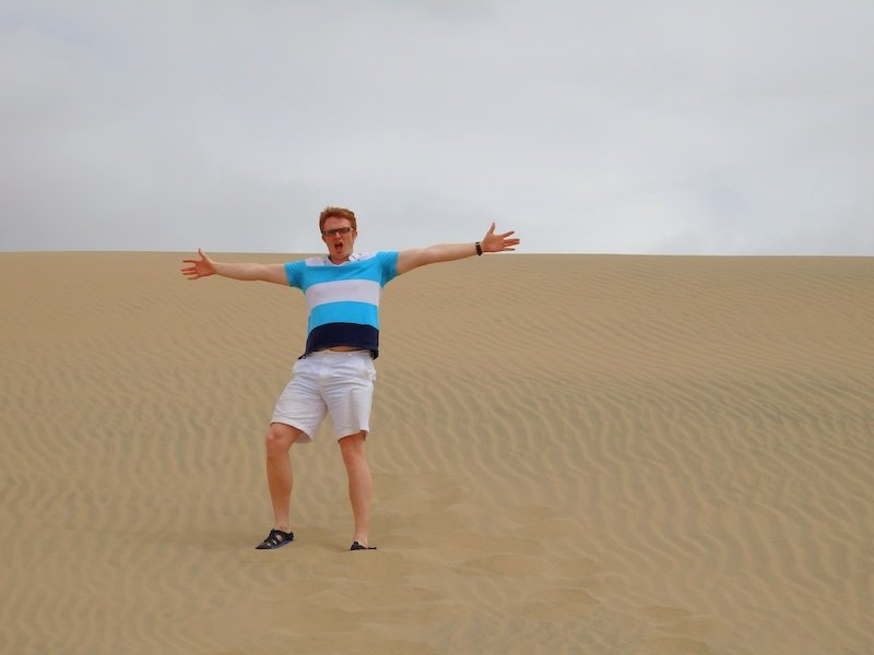 Nomadic Samuel having a great time traveling to Huacachina, Peru 
