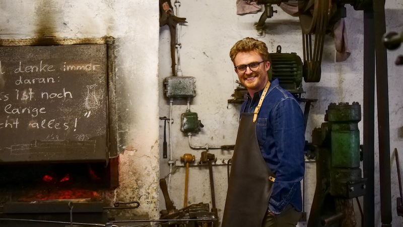 Nomadic Samuel learning how to be a blacksmith for a day trip in Germany 