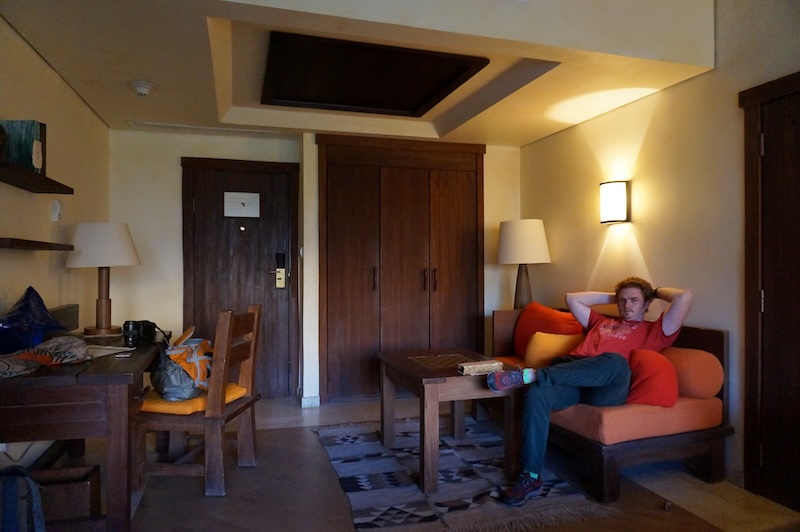 Nomadic Samuel lounging like a lizard on the couch of our comfortable hotel room in Petra, Jordan 