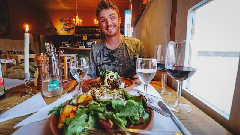 Nomadic Samuel loving the cuisine and wine and intimate settings in Northern Argentina on day trips from Salta 