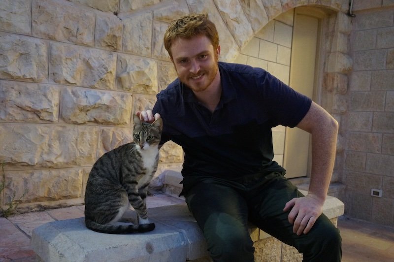 Nomadic Samuel making budget friends in Israel befriending a cute cat Nomadic Samuel making budget friends in Israel befriending a cute cat