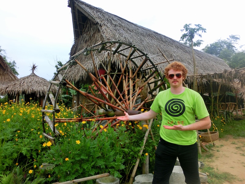 Nomadic Samuel presenting the water wheel at Tra Que Her in Vietnam 