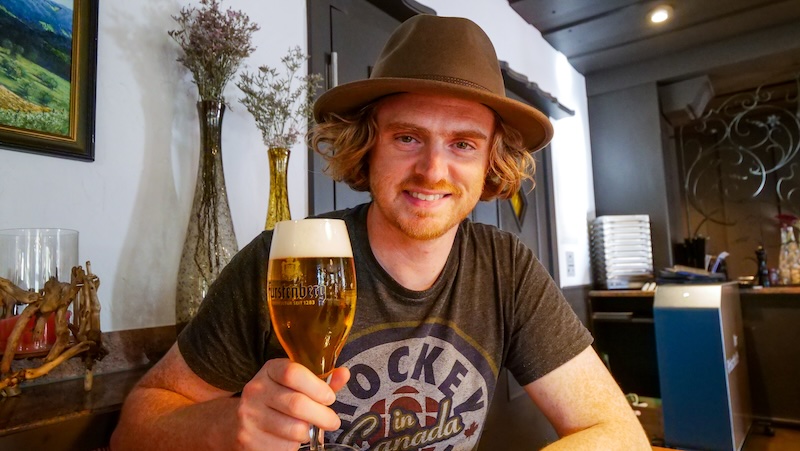 Nomadic Samuel raising a German pint to good times had on the Black Forest road trip Nomadic Samuel raising a German pint to good times had on the Black Forest road trip