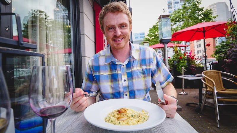 Nomadic Samuel ready to tuck into seafood pasta in Halifax, Nova Scotia, Canada 