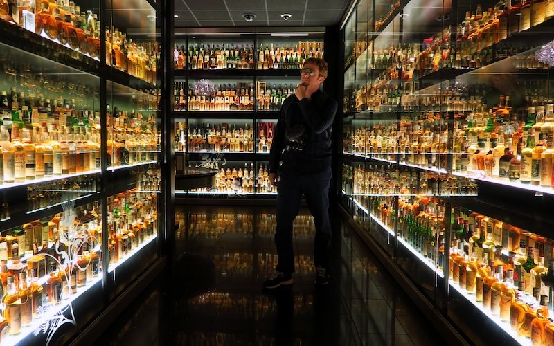 Nomadic Samuel exploring the world’s largest Scotch whisky collection at the Scotch Whisky Experience in Edinburgh, Scotland Nomadic Samuel exploring the world’s largest Scotch whisky collection at the Scotch Whisky Experience in Edinburgh, Scotland