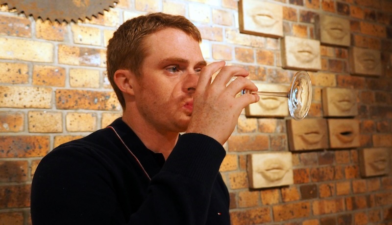 Nomadic Samuel sipping on wine in Stellenbosch, South Africa Nomadic Samuel sipping on wine in Stellenbosch, South Africa