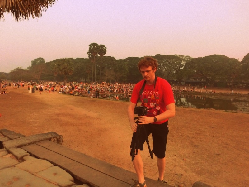 Nomadic Samuel taking photos at the Temples of Angkor, Cambodia 