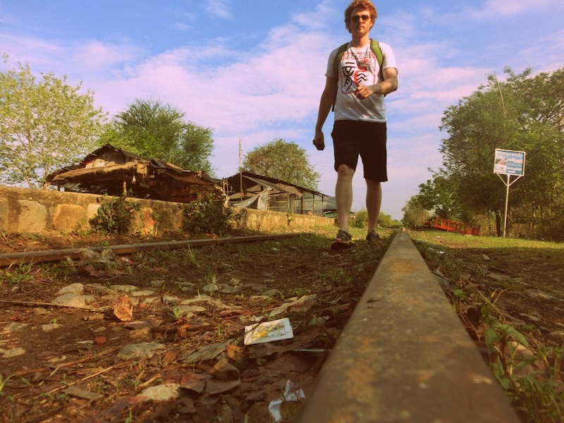Nomadic Samuel walking along the bamboo train tracks in Battambang, Cambodia 