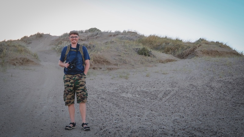 Nomadic Samuel with camera in hand ready to take photos in Peninsula Valdes, Argentina Nomadic Samuel with camera in hand ready to take photos in Peninsula Valdes, Argentina