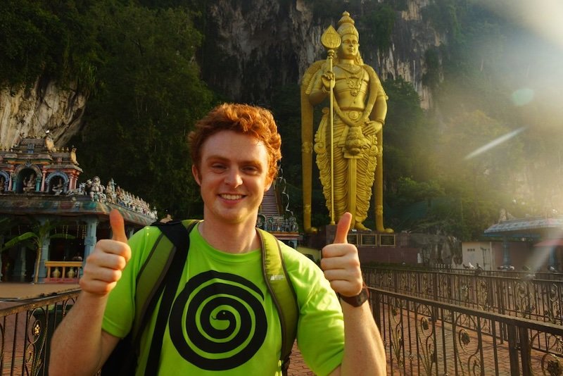 Nomadic Samuel with two thumbs up visiting the Batu Caves in Malaysia from Kuala Lumpur Nomadic Samuel with two thumbs up visiting the Batu Caves in Malaysia from Kuala Lumpur