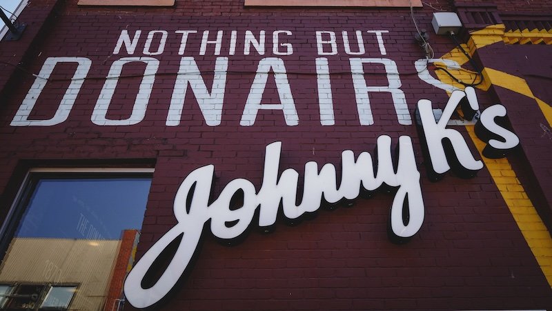 Nothing But Donairs Johnny K's brick wall sign in Halifax, Nova Scotia, Canada 