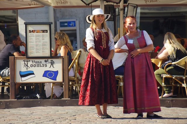 Olde Hansa ladies wearing traditional clothing in Tallinn, Estonia 