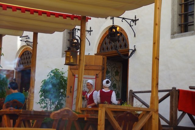 Olde Hansa servers dressed in traditional attire in Tallinn, Estonia 