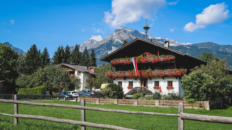One of the many farms in Reith im Alpbachtal with its distinct architectural design and mountain backdrop 