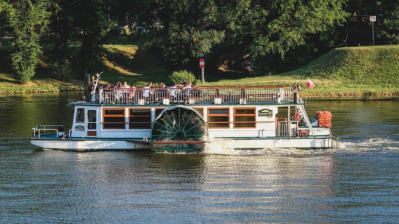 One of the many things to do in Krakow is to take a river cruise at sunset to take in the city slowly One of the many things to do in Krakow is to take a river cruise at sunset to take in the city slowly