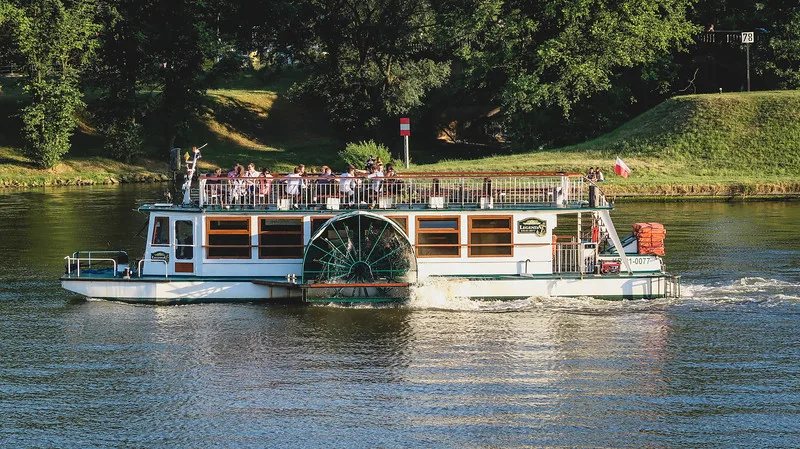 One of the many things to do in Krakow is to take a river cruise at sunset to take in the city slowly One of the many things to do in Krakow is to take a river cruise at sunset to take in the city slowly