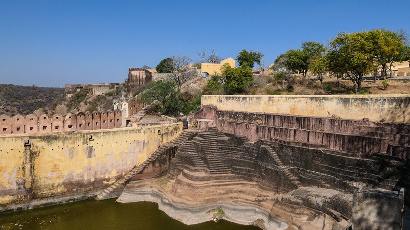 One of the stepwells in the outskirts of Jaipur with staircases leading from top to bottom in Rajasthan, India