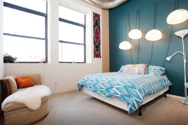 Our airbnb bedroom in Chicago, Illinois, USA with studio lighting for a comforting touch 