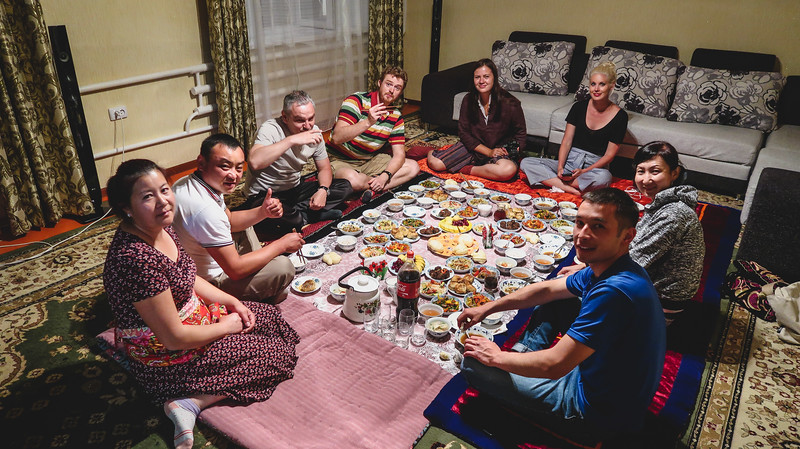 Our hungry group enjoying a Kyrgyz feast! We loved the communal aspect of eating a traditional meal together on the floor in Karakol