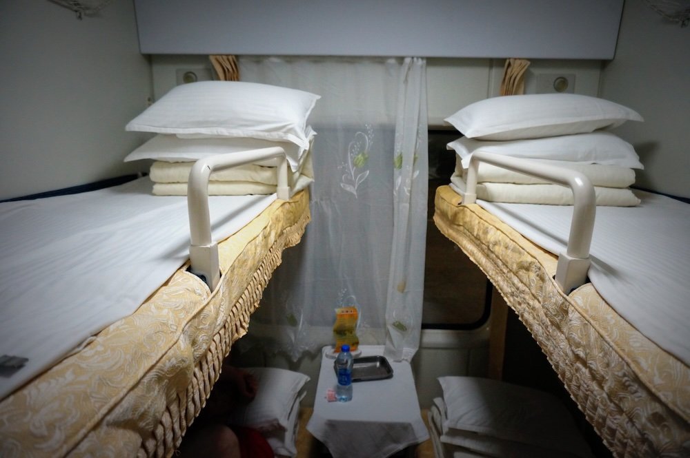 Overnight sleeper birth long distance train in China to Guilin with bunk bed views from an overhead perspective 
