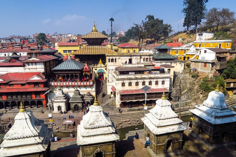 Panoramic view of Pashupatinath Temple in Kathmandu, Nepal’s most sacred Hindu pilgrimage site along the Bagmati River, showcasing golden rooftops, shrines, and spiritual rituals